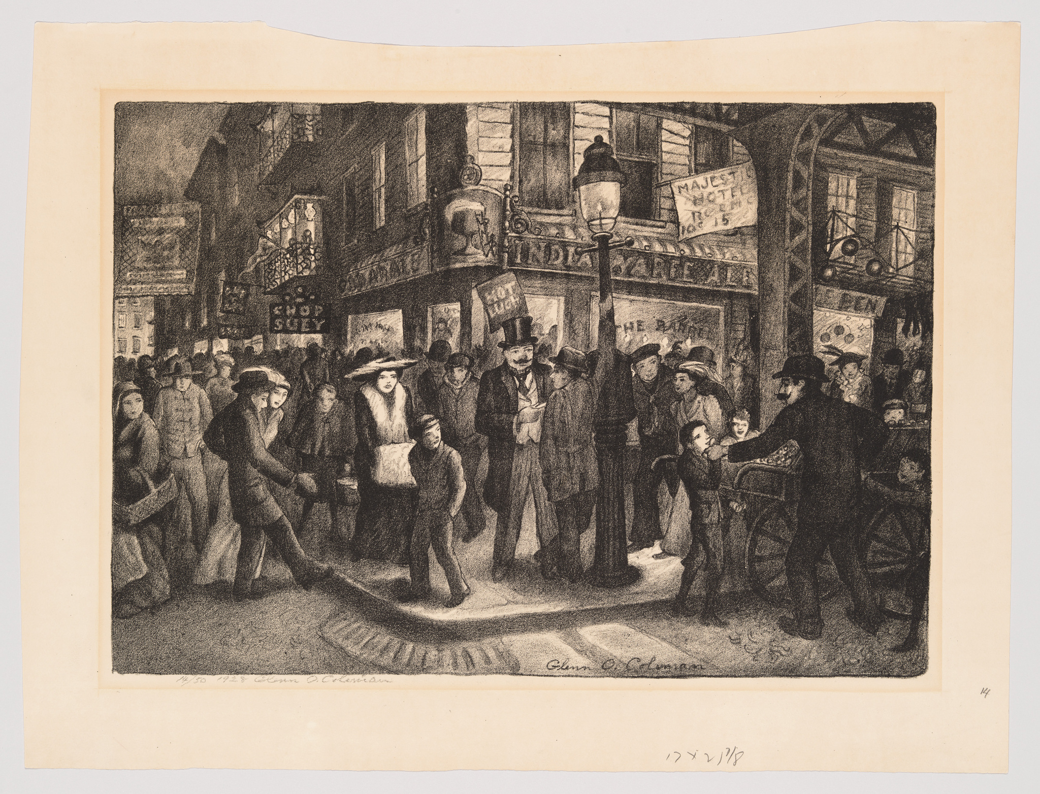 A black and white etching depicting a bustling street scene at night with a crowd of people. Some individuals are crossing the street, while others gather around a shop window. Gas street lamps illuminate the scene, and various signs, including one that reads "INDIA CARPET," are visible above the shop fronts. The artwork is signed by the artist in the lower right corner.
