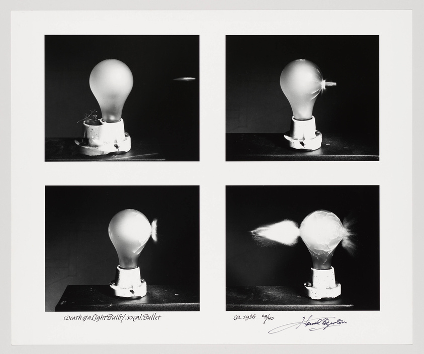 A black and white photo collage featuring four sequential images of a light bulb mounted on a socket, capturing the moment it is shot and shatters. The first image shows the intact bulb, the second shows the initial impact, the third displays the bulb with a small puff of smoke, and the fourth shows the bulb exploding with shards of glass flying away. There is handwriting at the bottom of the images indicating the title and the artist's signature.