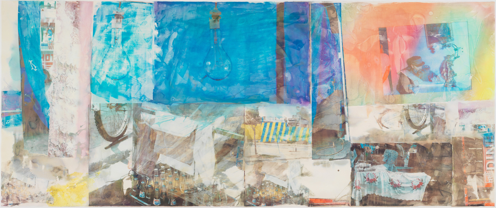 A wide, panoramic mixed-media artwork featuring an array of overlapping images and textures. Dominant hues of blue, orange, and pink create a vibrant collage with discernible elements such as a light bulb, bicycle wheel, and various urban and abstract motifs. The piece conveys a sense of layered depth and eclectic visual narrative.