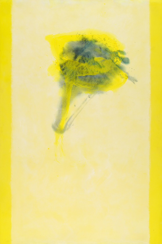 Abstract yellow and black spray paint blot on a pale yellow background with a bright yellow border. The paint blot has a diffuse, cloud-like appearance with a concentration of black in the center, suggesting a dynamic, spontaneous application.