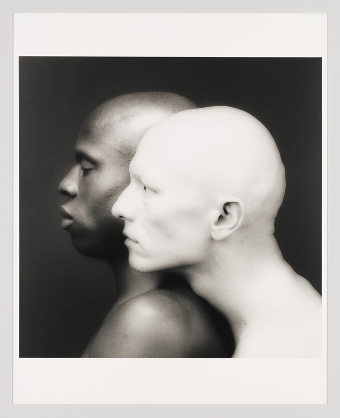 Profile view of a person and a mannequin head back-to-back against a white background.