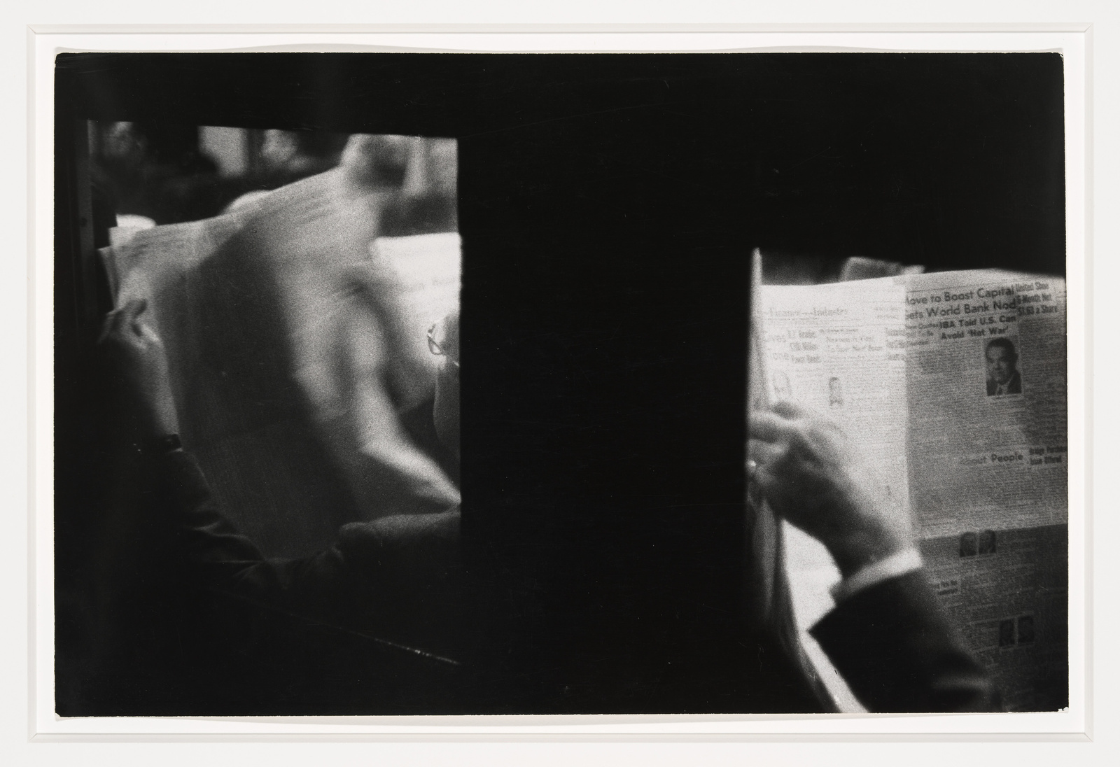 Two people reading newspapers in a dimly lit setting, with one paper partially obscured by shadows.