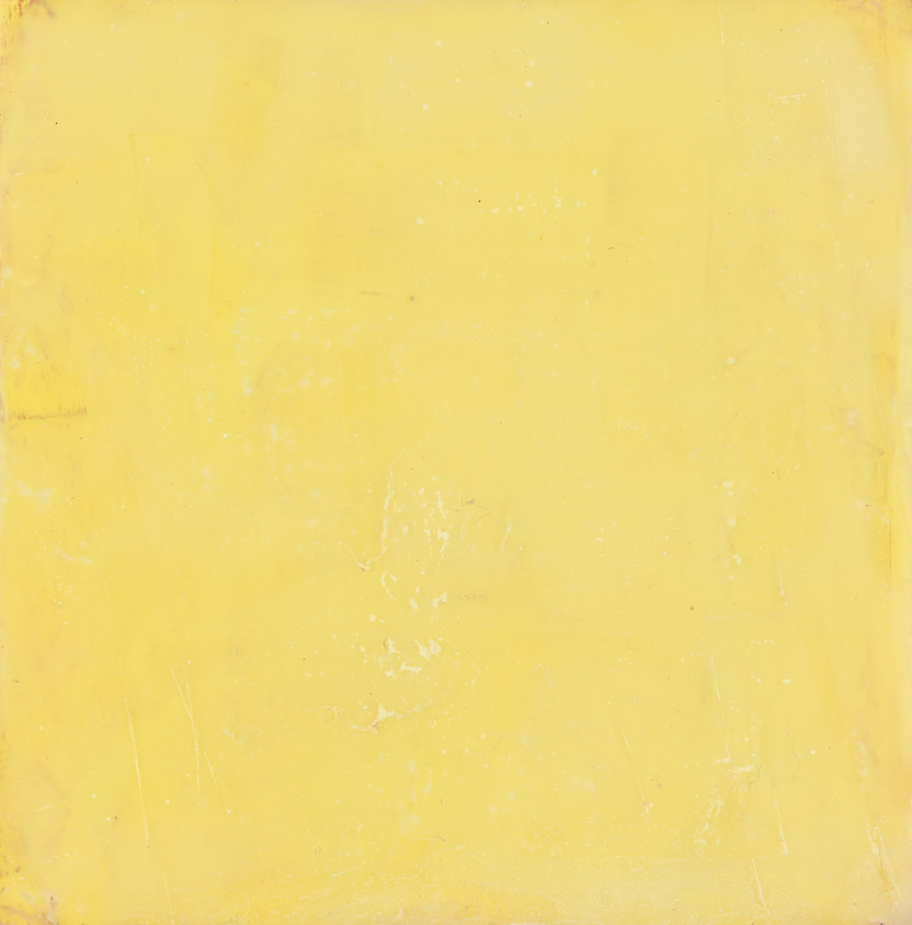 A monochromatic yellow canvas with a textured surface showing signs of wear and subtle variations in shade.