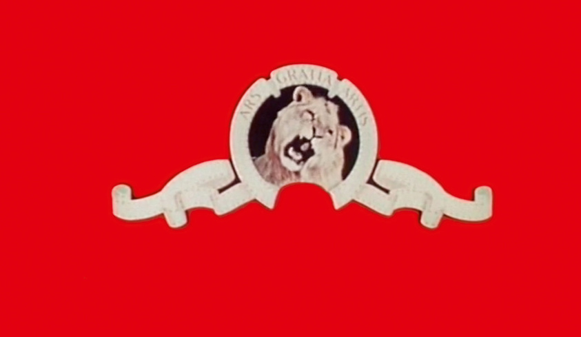 A white silhouette of a lion with "MGM GRAND HOTEL" text on a red background.