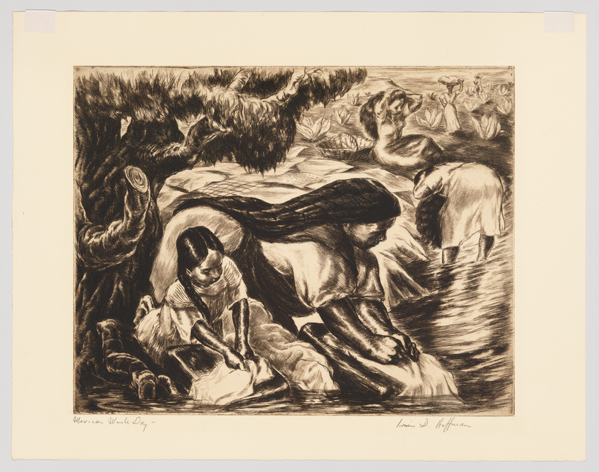 This is a detailed black and white etching depicting a group of women engaged in laundry work by a river. One woman kneels in the foreground, scrubbing cloth against a washboard, while another stands in the water, wringing out a garment. In the background, more women perform similar tasks, with lush vegetation partially obscuring the scene. The artwork conveys a sense of communal labor and has a dynamic, almost urgent quality to the strokes that capture the textures of the environment and the movement of the workers. The artist's signature is visible in the lower right corner.