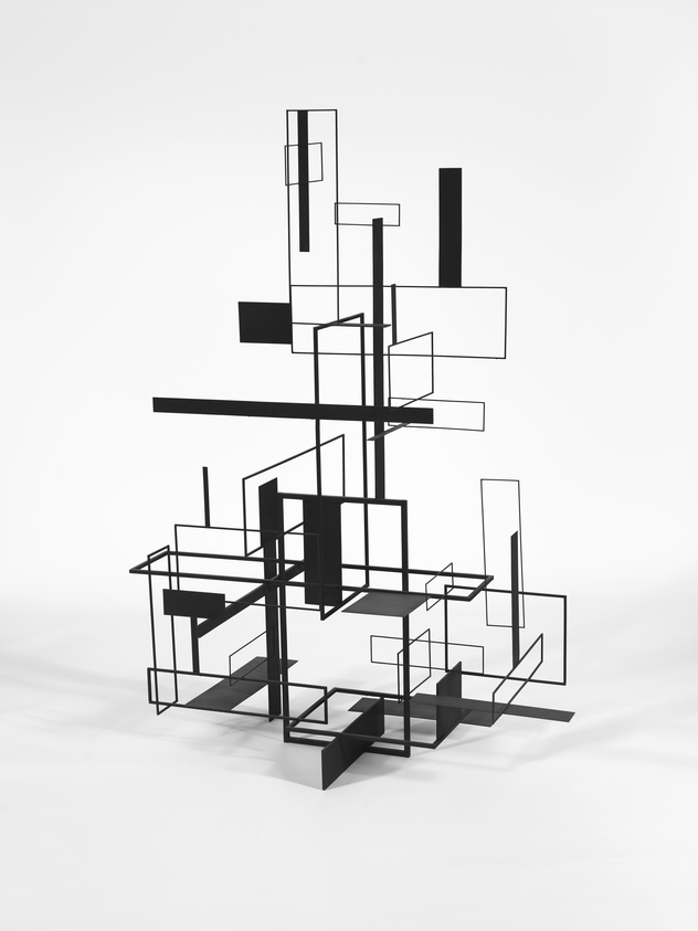 A monochromatic, abstract sculpture composed of interconnected black lines and geometric shapes creating a three-dimensional form on a white background.