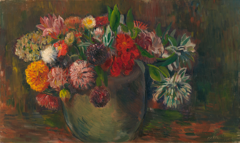 Oil painting of a vibrant bouquet of assorted flowers in a green vase, set against a dark, impressionistic background. The flowers, depicted in various stages of bloom, showcase a palette of reds, yellows, pinks, and whites with lush green foliage interspersed throughout. The brushwork is loose and expressive, suggesting the texture and vitality of the blossoms. The painting is signed in the lower right corner.