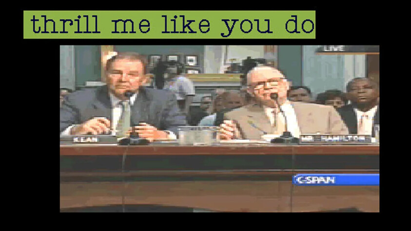 Two men in suits sit at a table during a C-SPAN broadcast. Text above reads "thrill me like you do."