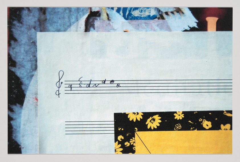 A collage of various paper elements including a piece of sheet music with a treble clef and a few musical notes, a floral patterned strip, and an abstractly textured background with hints of blue and red. The overall image has a textured, layered appearance with a mix of artistic and musical themes.