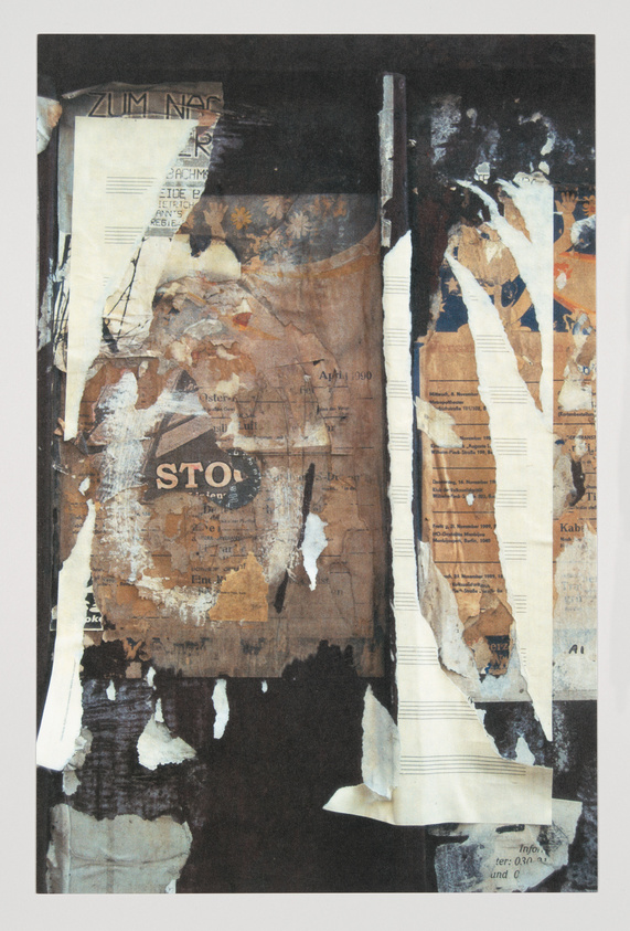 A textured collage featuring a variety of layered papers with printed text, musical notation, and floral patterns, some pieces torn or peeling, with a prominent word "STOP" in the center against a darkened backdrop. The overall color palette is a mix of earth tones with spots of blue and white.