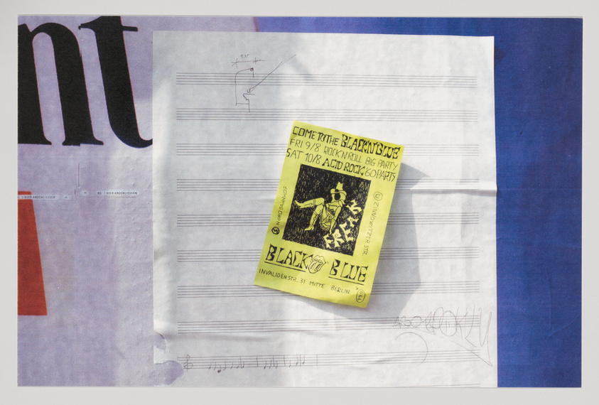 A collage of various papers including a yellow flyer with text advertising a rock and roll party, musical score sheets, and a partial view of a magazine cover with large typography. The flyer features an illustration of a band and text that reads "BLACK'N'BLUE," with event details for two dates. The score sheets have handwritten musical notes and doodles. The magazine cover is only partially visible with the letters "nt" in large black font on a purple background.