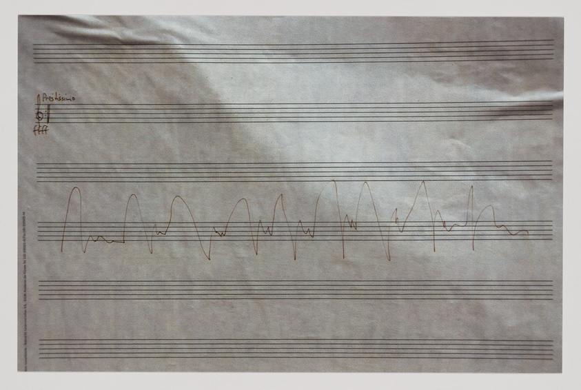 A piece of aged sheet music paper with a series of musical staff lines and a squiggly, continuous line resembling a sound wave or scribble drawn across the staves. On the top left, there's a handwritten annotation that appears to say "Profissimo" with a dynamic marking and a treble clef symbol.