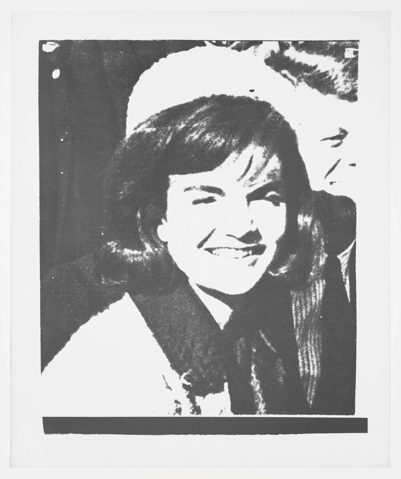 A high-contrast black and white photo of a smiling woman in the foreground with a man partially visible in the background. The image has a grainy texture and appears to be a photocopy or a print with high exposure, resulting in a loss of detail in the lighter areas. The top left corner shows what appears to be a hole punch or similar marking.