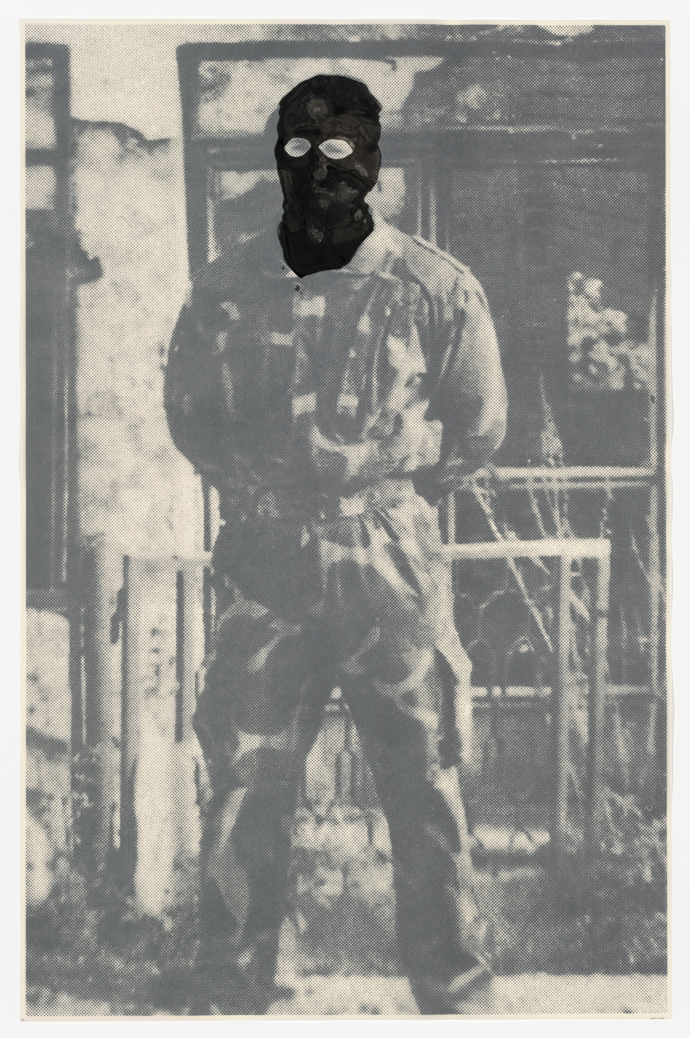 A vintage black and white photo depicting a person standing in front of a blurred background that appears to be a building with windows. The person's face is obscured by a mask or damage to the photograph, creating a mysterious and eerie effect. The individual is wearing a long-sleeved shirt and pants, and the overall image has a grainy texture, suggesting age and wear.