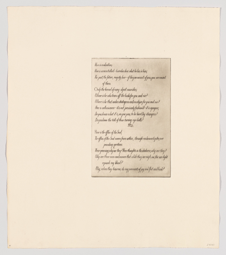 A photograph of a piece of paper with a block of text centered on it, surrounded by a wide margin of blank space. The text appears to be a poem or a reflective piece of writing, and the paper is slightly aged with a creamy background.