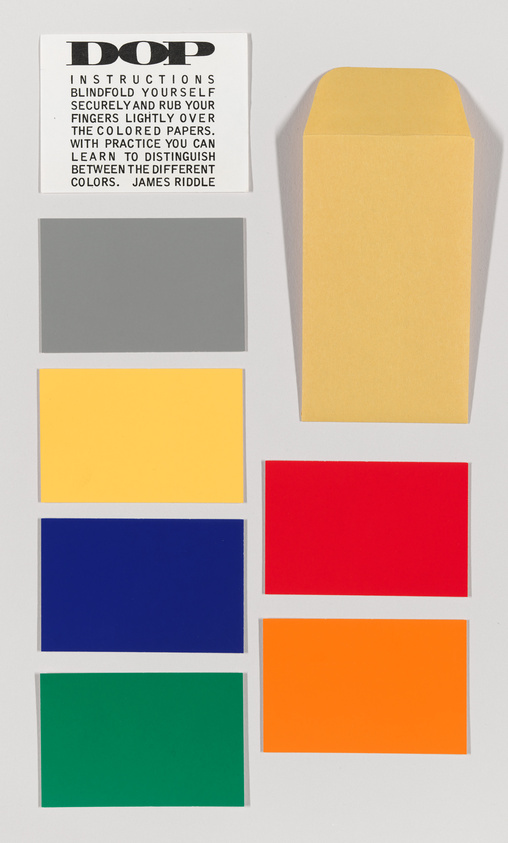 A collection of six colored rectangles arranged in two columns on a white background, with a yellow envelope on the right and a set of instructions titled "DOP" on the top left corner. The instructions suggest blindfolding oneself and rubbing fingers over the papers to distinguish colors by touch, attributed to James Riddle. The colors from top to bottom on the left column are gray and yellow, and on the right column are blue, red, and green, with an orange rectangle spanning across both columns at the bottom.