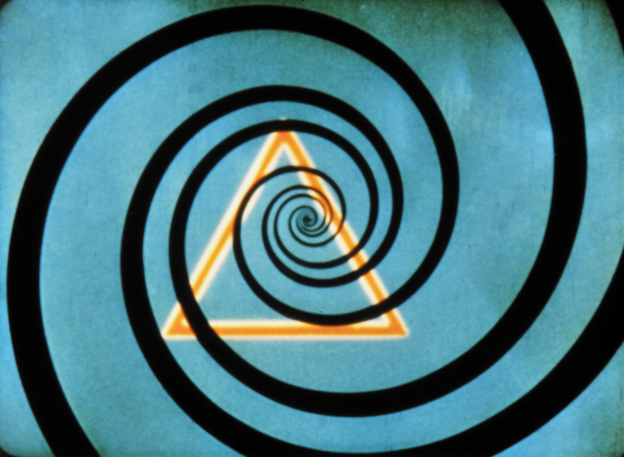 Black spiral pattern over a glowing yellow triangle on a blue background.