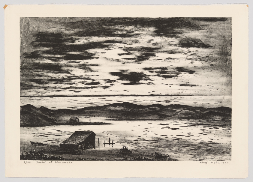 This is a black and white etching depicting a tranquil landscape scene titled "Sunset at Memensha." The foreground features a small, dark building with a pitched roof next to a body of water, with a fence and a rowboat nearby. Gentle hills rise in the middle ground, while the background shows a dramatic sky filled with clouds reflecting the light of the setting sun over the water. The artist's signature and the date 1933 are visible in the lower right corner, and the print is numbered 7/100 in the lower left corner.