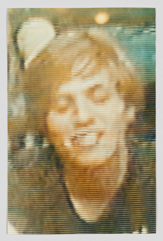 A pixelated image of a person with short hair, eyes closed, and a slight smile, in a yellow and blue color scheme.