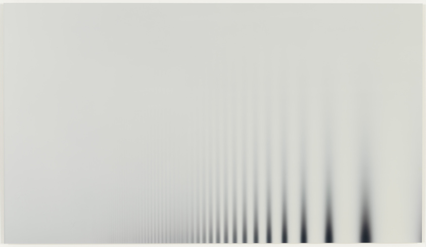 A blurred image with a gradient from left to right, starting with a white background that progressively fills with vertical black lines becoming denser towards the right side.