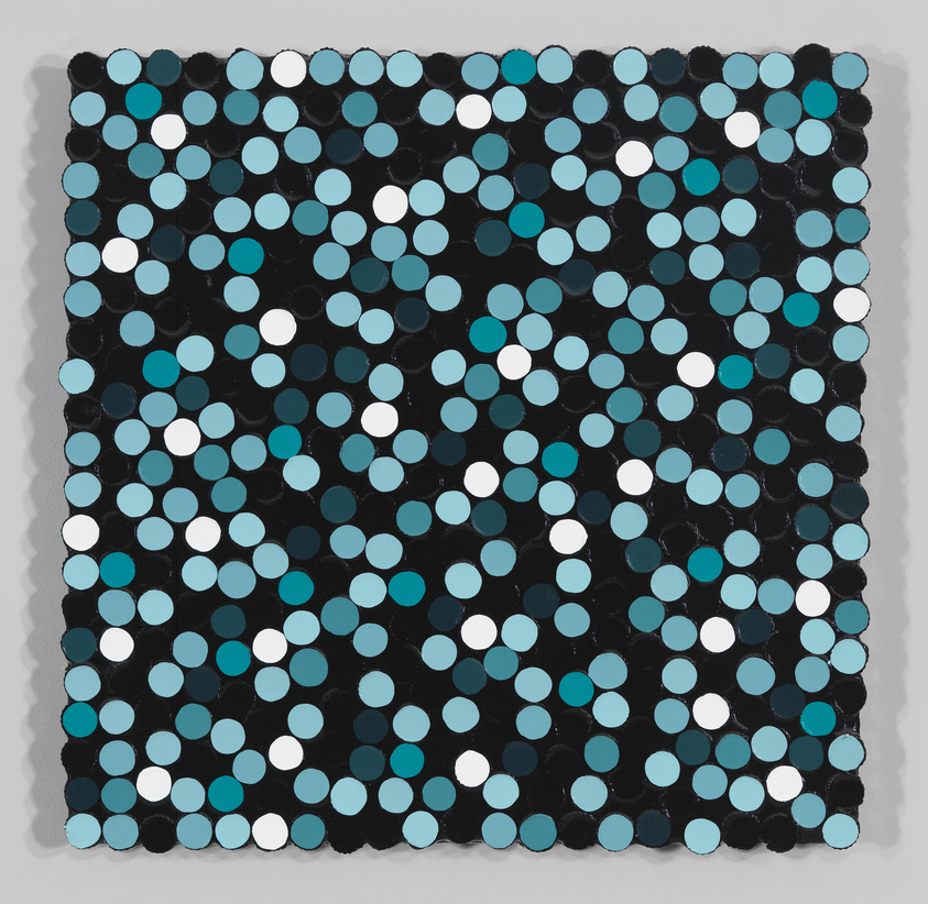 A close-up view of an abstract painting featuring a grid of circles in varying shades of blue, black, and white, creating a sense of depth and movement on a textured surface.