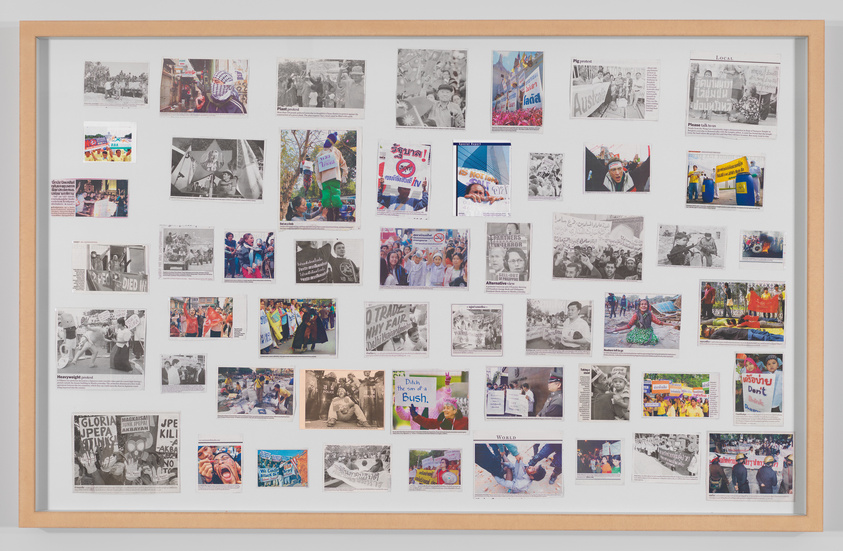A framed collage of various photographs and newspaper clippings, some in color and others in black and white, depicting diverse scenes and events.