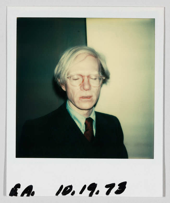 A man with light hair and glasses stands with his eyes closed. Handwritten date reads 10.19.73.