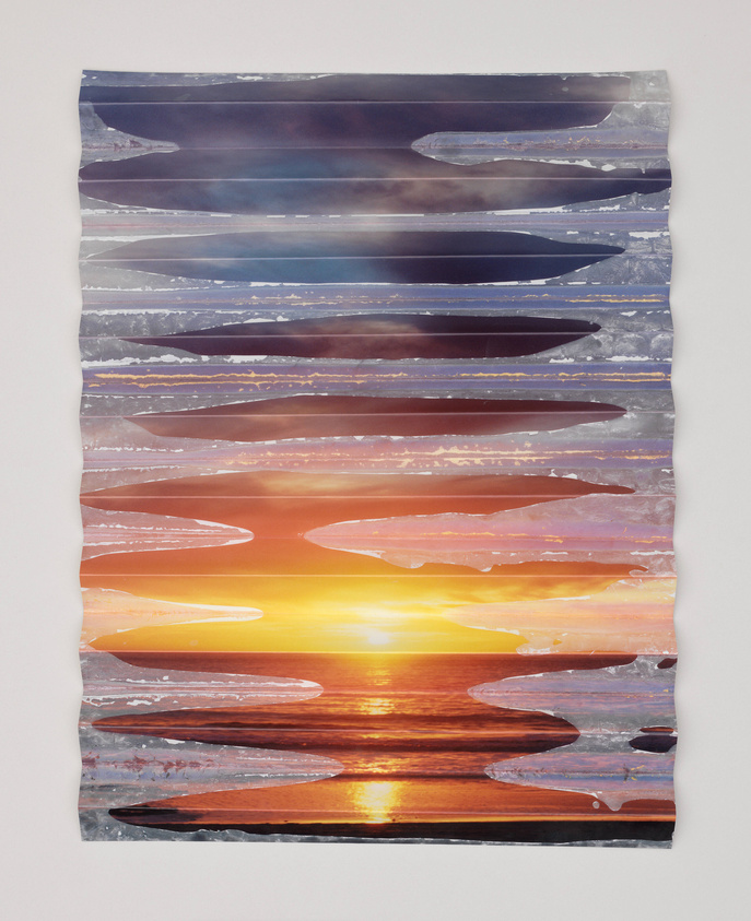 A textured artwork depicting a layered sunset over the ocean, with the image sliced into horizontal strips and slightly staggered to create a fragmented yet cohesive scene. The colors transition from cool purples and blues at the top to warm oranges and yellows at the bottom, evoking a serene coastal dusk.