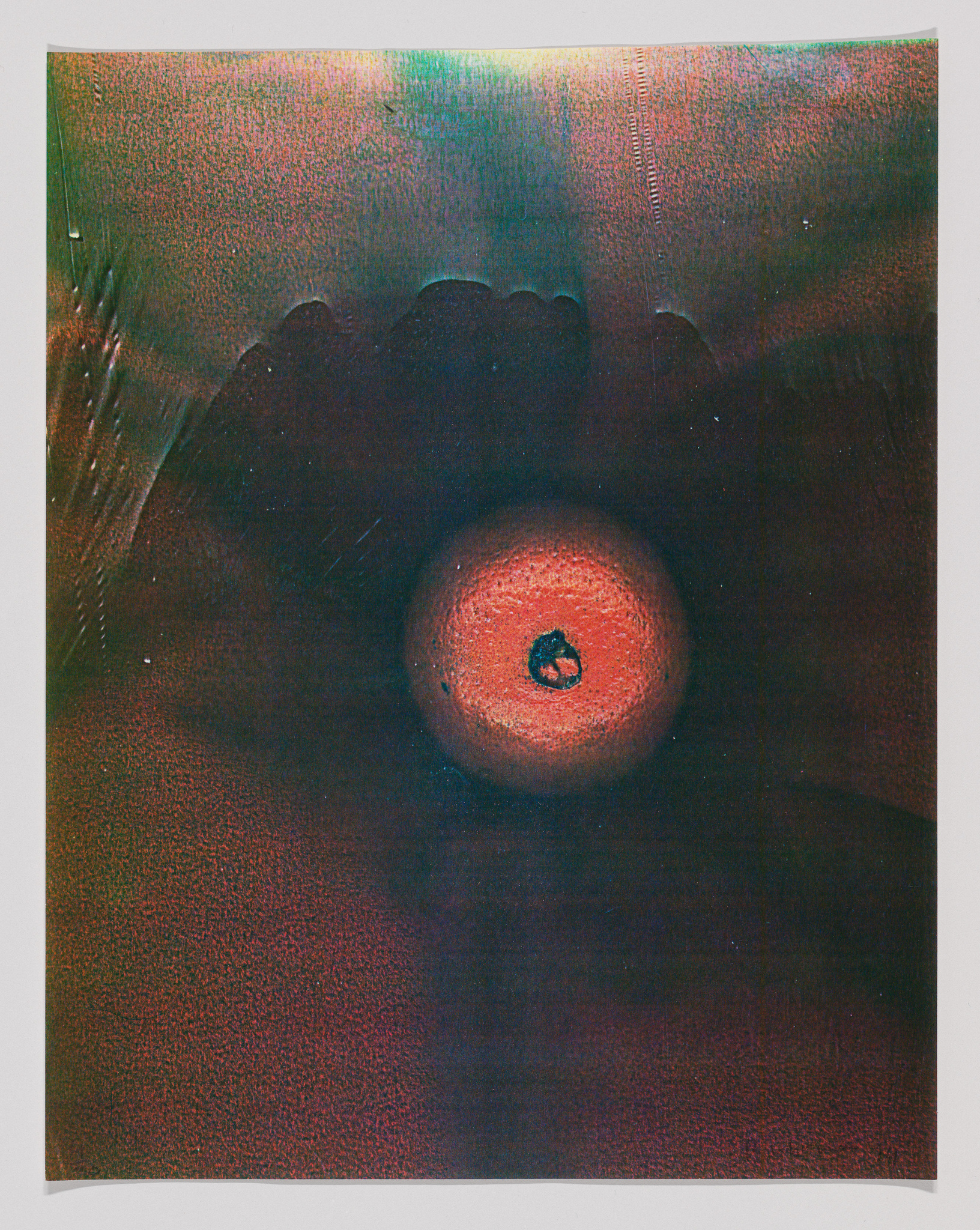 Abstract artwork with a central red-orange circle and textured shades of red and green surrounding it.