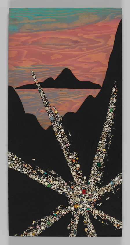 A sunset sky with dark mountains and a large sparkling leaf shape decorated with colorful beads and gems.