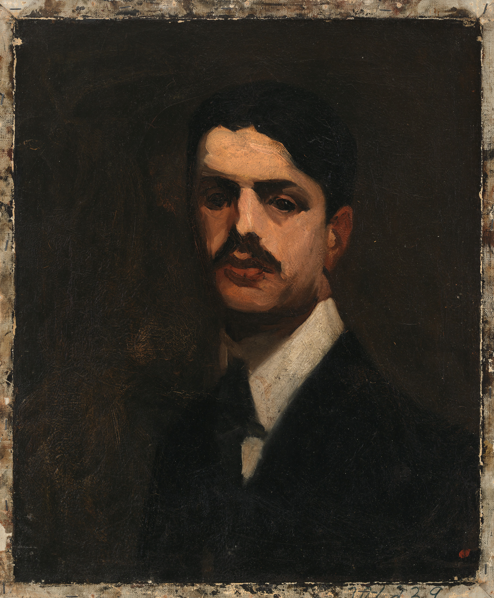 Portrait of a mustachioed man in formal attire against a dark background.