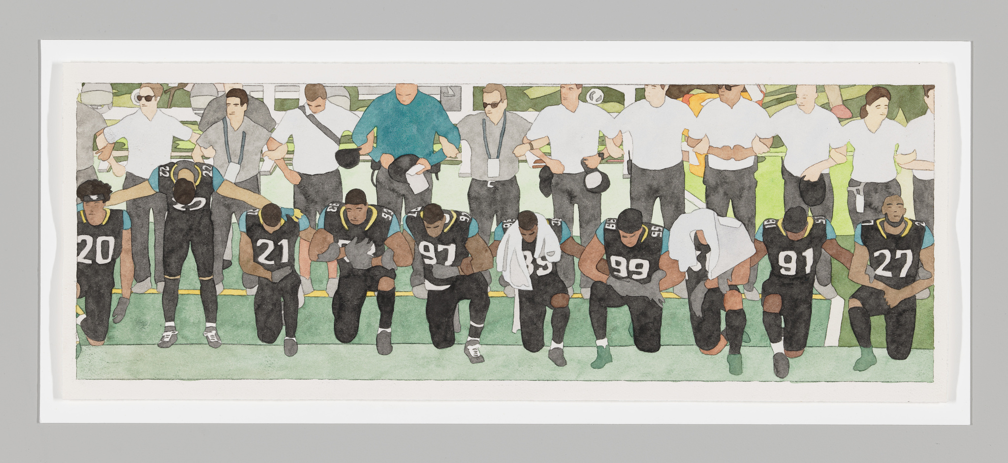Still of Black football players taking a knee in front of a row of white coaching staff who are standing and linking arms.