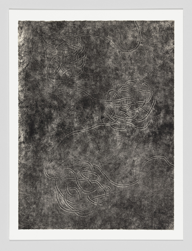 Three tangled lines or cords are spread across a dark, textured background, each forming a loose knot.