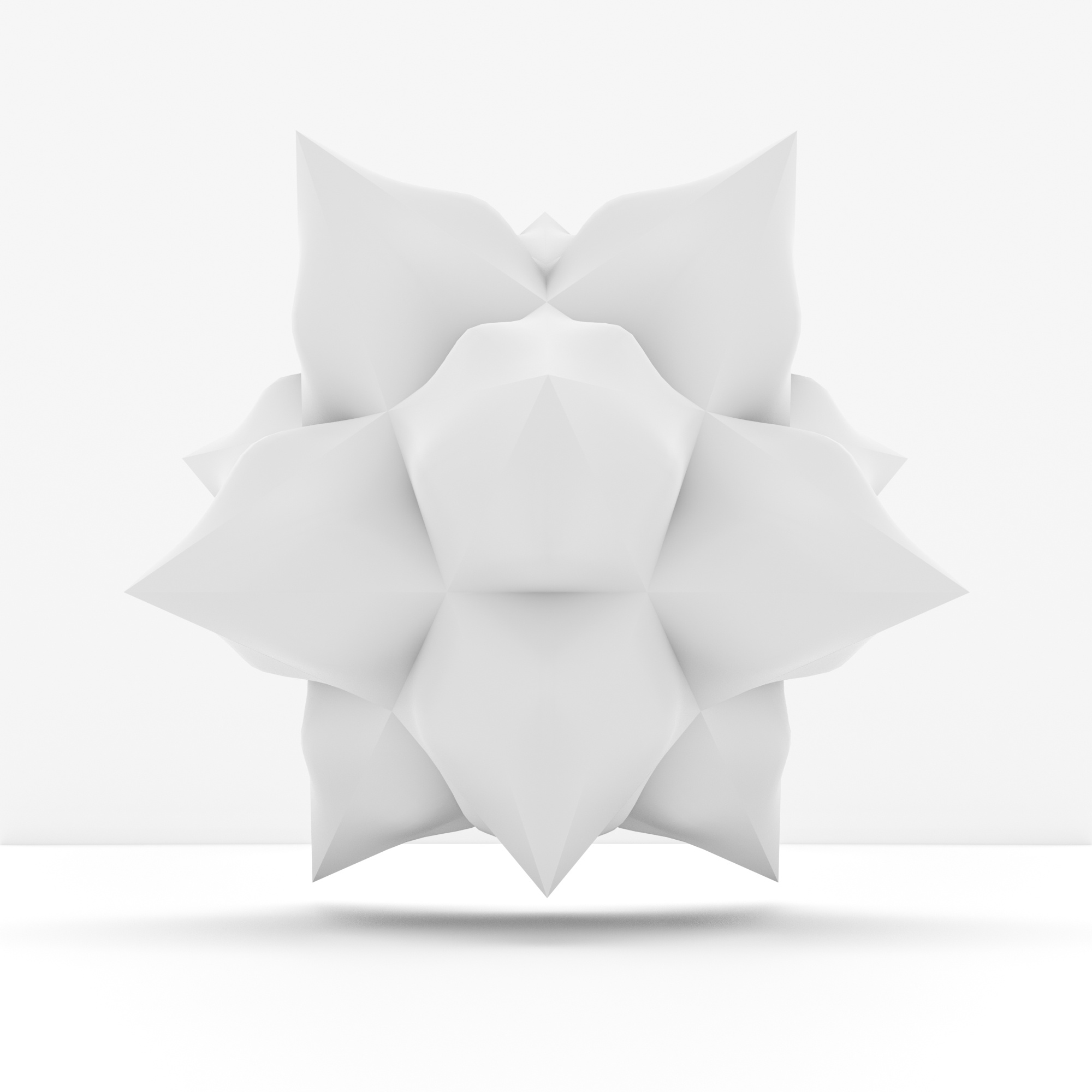 A white, geometric, flower-like sculpture on a seamless white background.