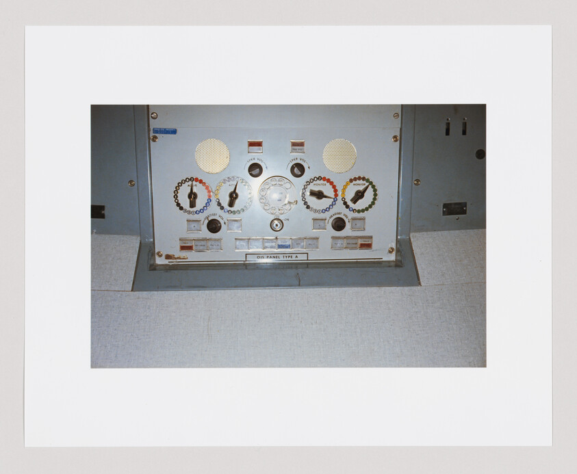Control panel with dials, switches, and colored indicators labeled "DIS PANEL TYPE A" in the center.