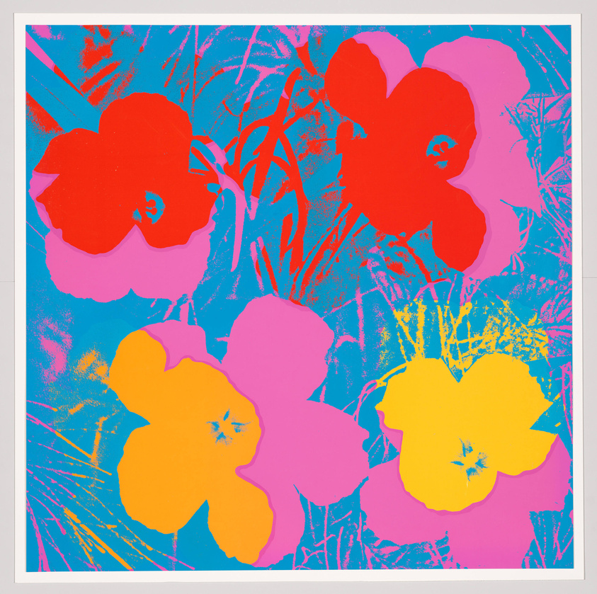 A vibrant pop art style print featuring large, stylized flowers in bold red, pink, and yellow hues set against a bright blue background with abstracted plant silhouettes.
