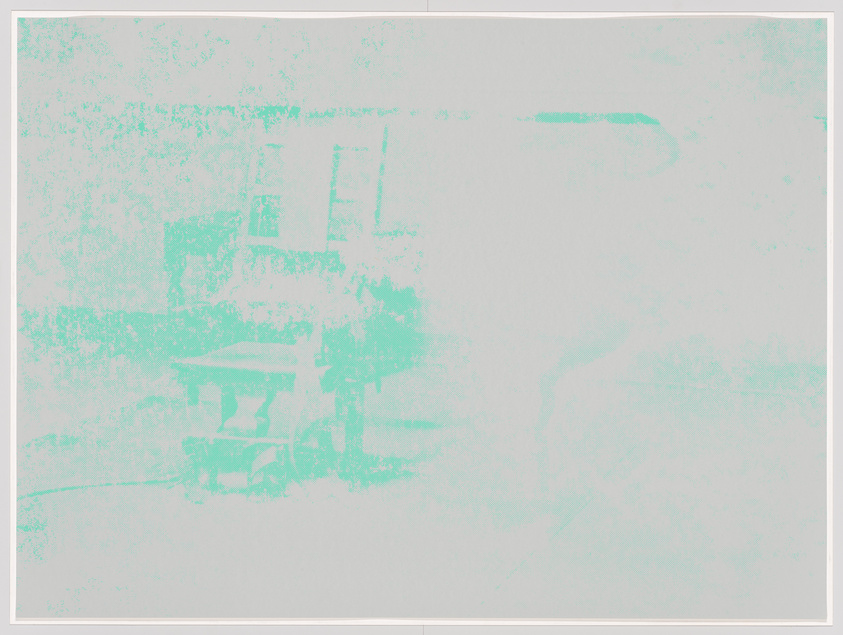 Faint, monochromatic image of a street scene with indistinct shapes resembling buildings and possibly a person.