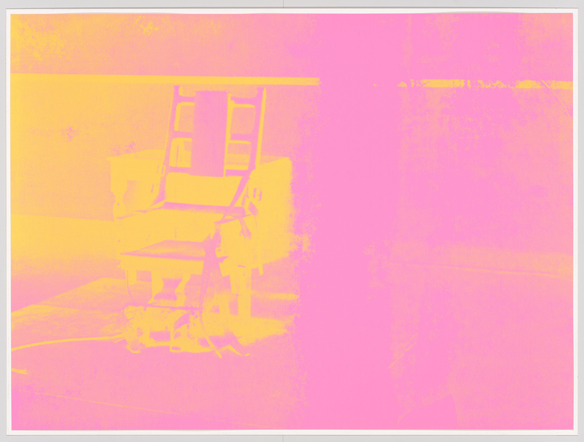 A heavily color-filtered image of a chair and desk, making details hard to discern.