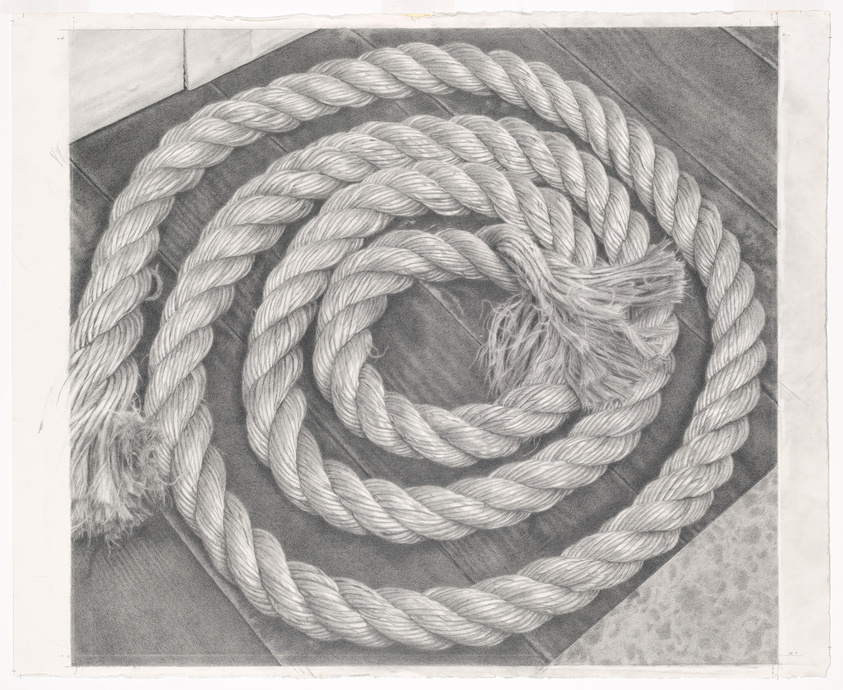 A coiled thick rope with frayed ends is laid out on a flat surface, with the coil pattern creating a spiral effect. The image is monochromatic, resembling a pencil drawing with detailed shading to give the rope a textured appearance. The background includes a corner of two walls and a patterned floor, suggesting an indoor setting.