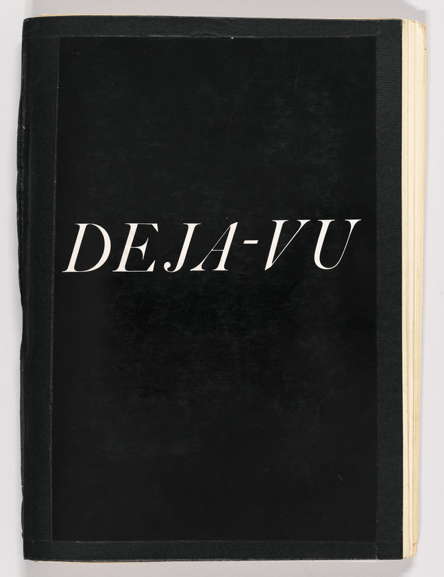 A worn black hardcover book with the title "DEJA-VU" in white serif font centered on the cover, with visible signs of use and shelf wear. The book's pages appear aged with a yellowish tint on the edges.