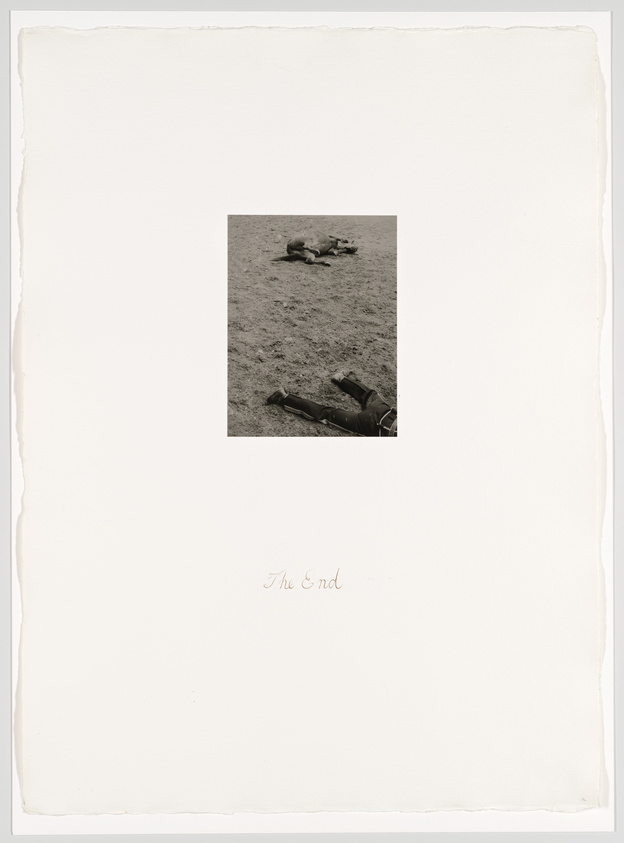 A small black-and-white photo of a horse and person lying on the ground, centered on a large white page with "The End" written below.