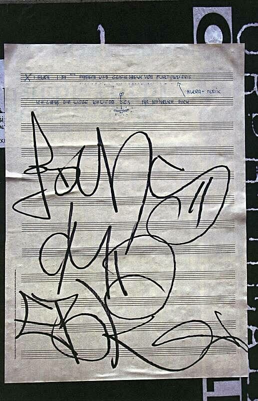 Graffiti artwork in black lines on white paper by Christian Marclay.
