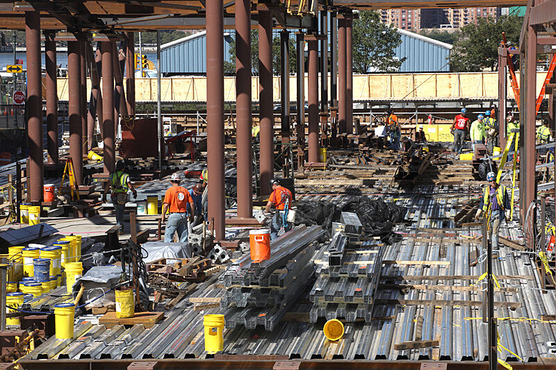 Laying down the first floor of the building.