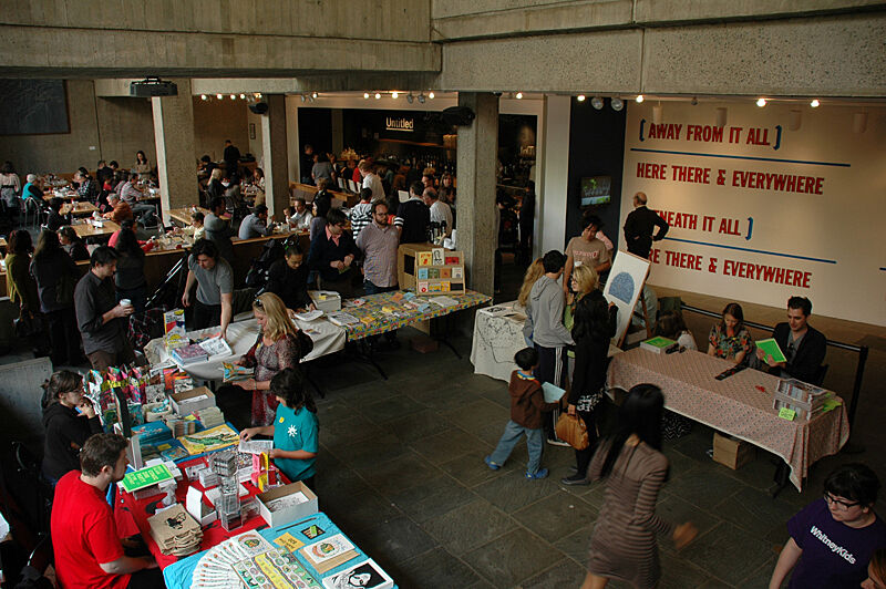 Museum is set up with booths and tables.
