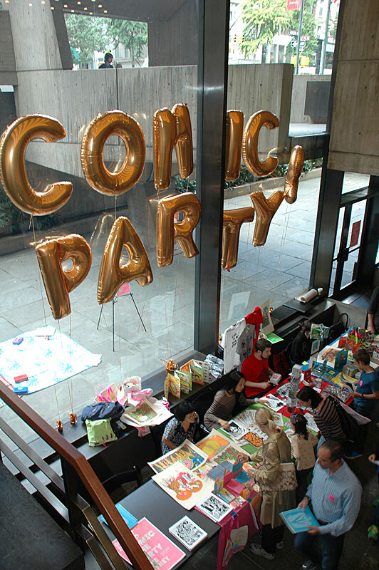 Colorful prints with balloon letters above it.