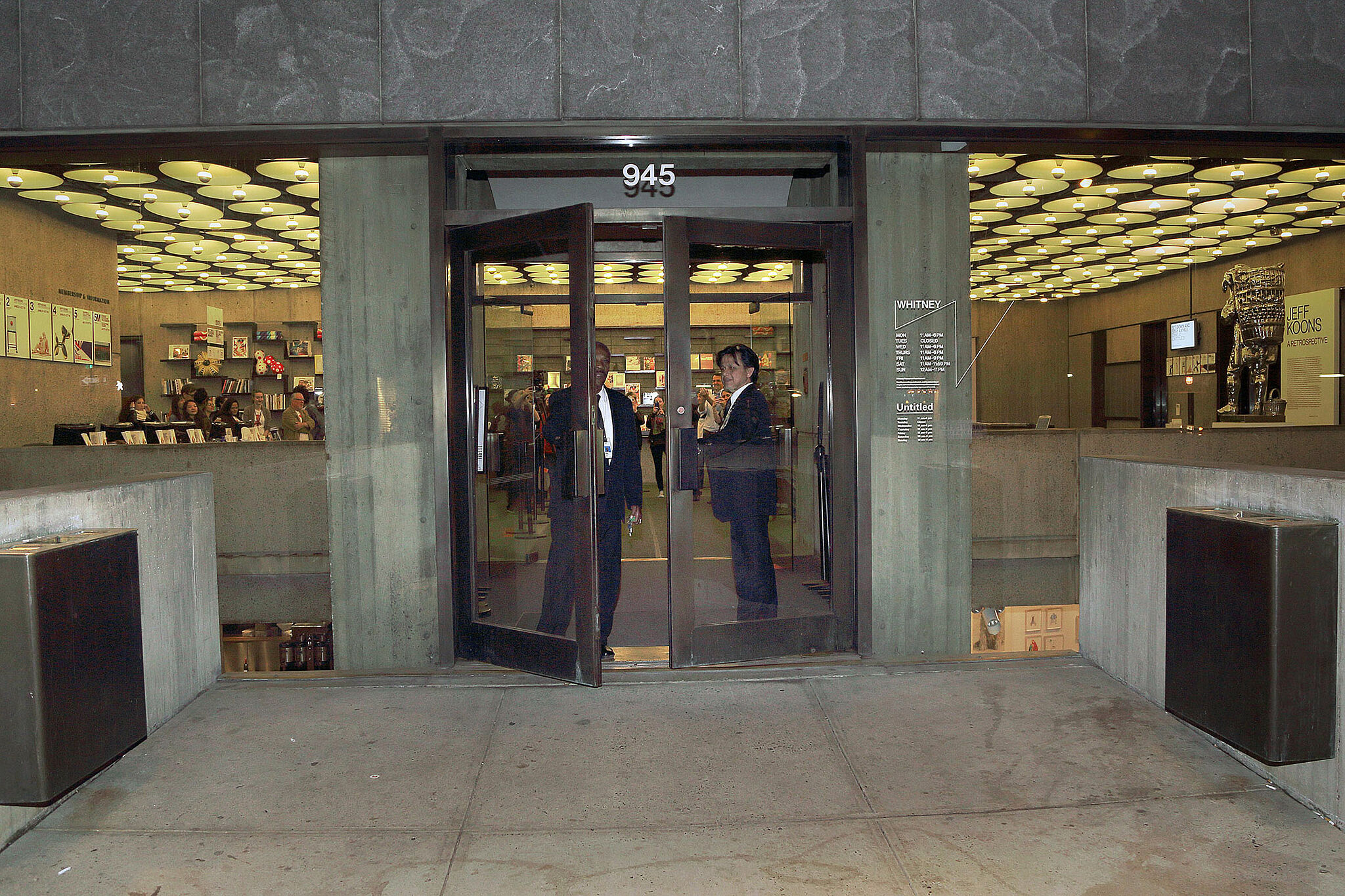 Men opening up doors to the Whitney.