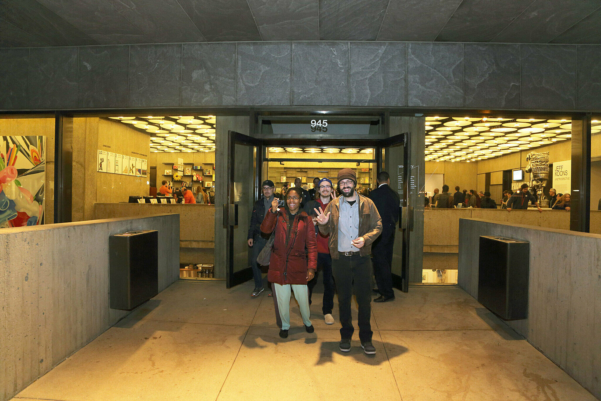 Visitors waving to the camera.