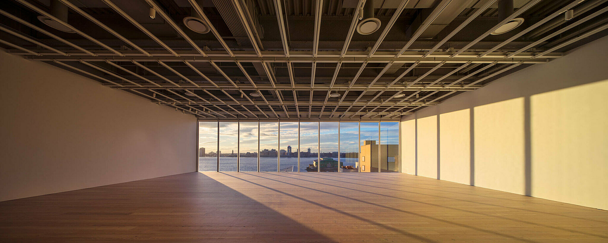 The empty fifth-floor gallery looking out onto Hudson River.