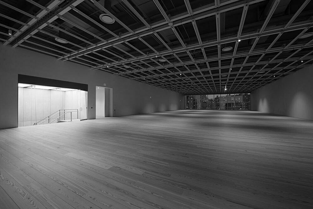The empty fifth floor galleries of the Whitney Museum lit at night