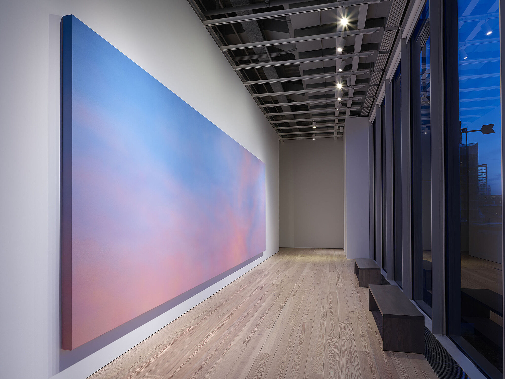 A long painting takes up a full wall in a gallery at the Dreamlands exhibit.